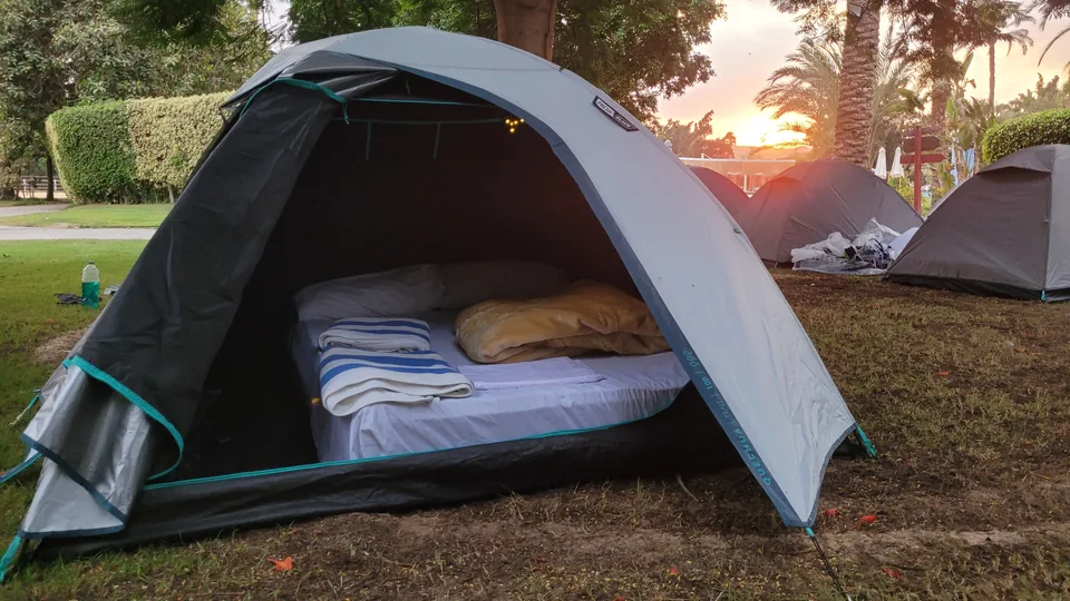 The interior of a prepared two-person glamping tent